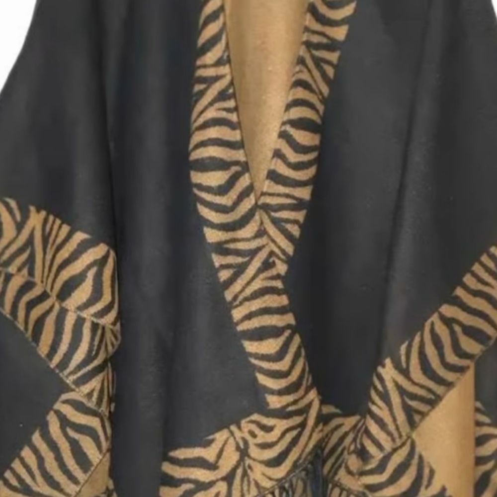 Accessory Street reversible black and light brown zebra print cape/poncho.